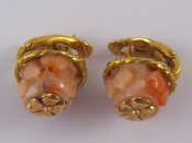 Appraisal: A pair of yellow metal coral earrings unascribed mark possibly