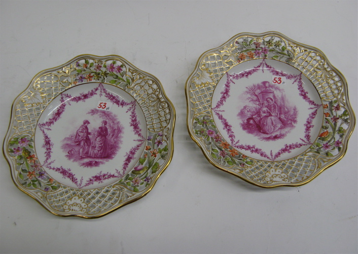 Appraisal: PAIR OF DRESDEN PORCELAIN PLATES magenta colored courting scenes on