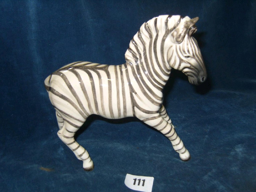 Appraisal: A Beswick model of a prancing zebra with circular printed