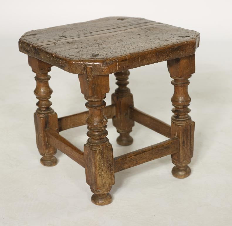 Appraisal: th CENTURY OAK STOOL the seat with cut-off corners raised