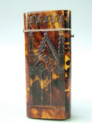 Appraisal: A mid Victorian pressed tortoiseshell gothic revival cigar case of