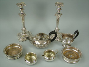 Appraisal: A pair of silver plated candlesticks together with two silver