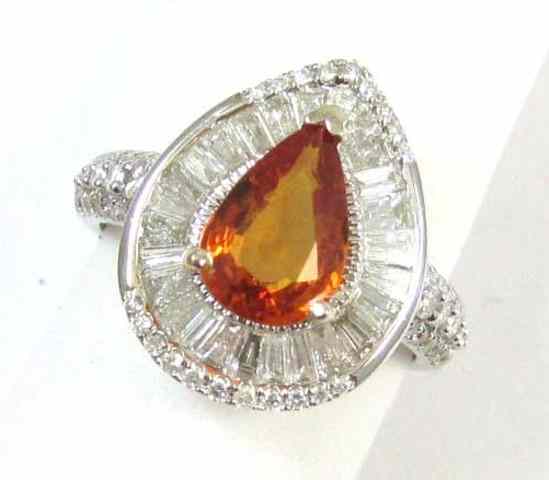 Appraisal: ORANGE SAPPHIRE AND DIAMOND RING k white gold with tapered