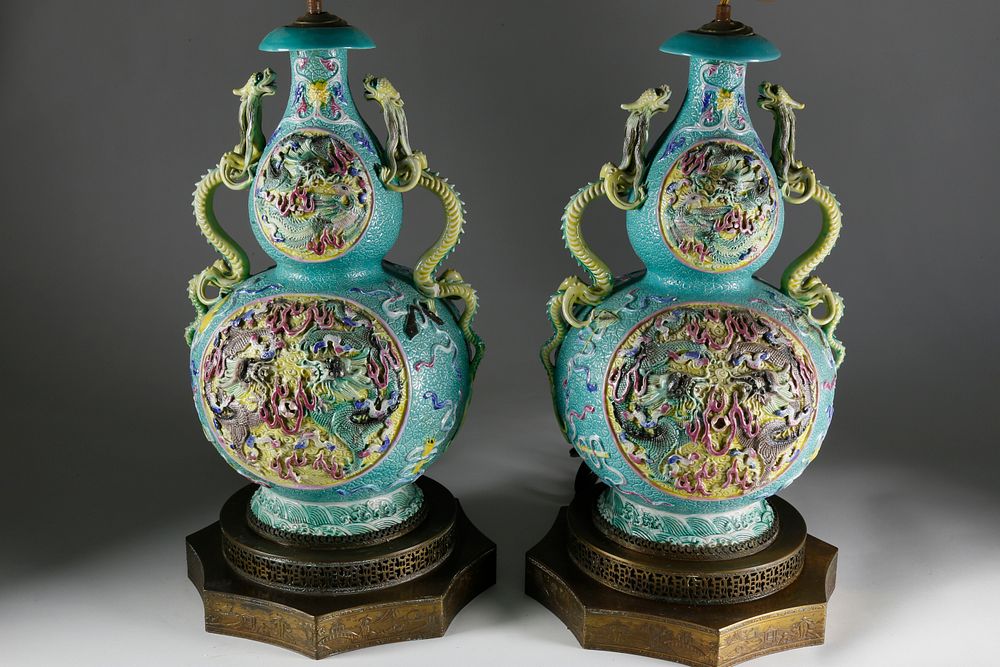 Appraisal: Pair of Chinese Porcelain Embossed Lamps circa Pair of Chinese