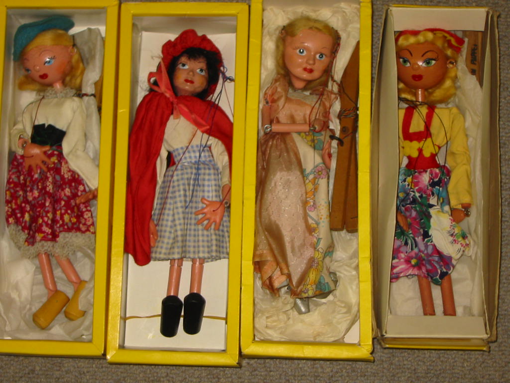 Appraisal: Four Pelham puppets SL Red Riding Hood yellow window box