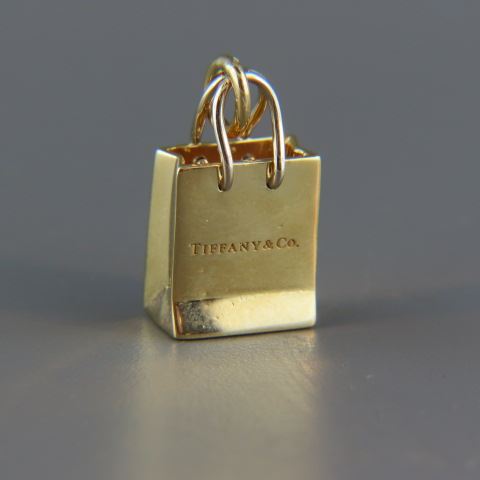 Appraisal: Tiffany k Gold Charm Tiffany shopping bag grams