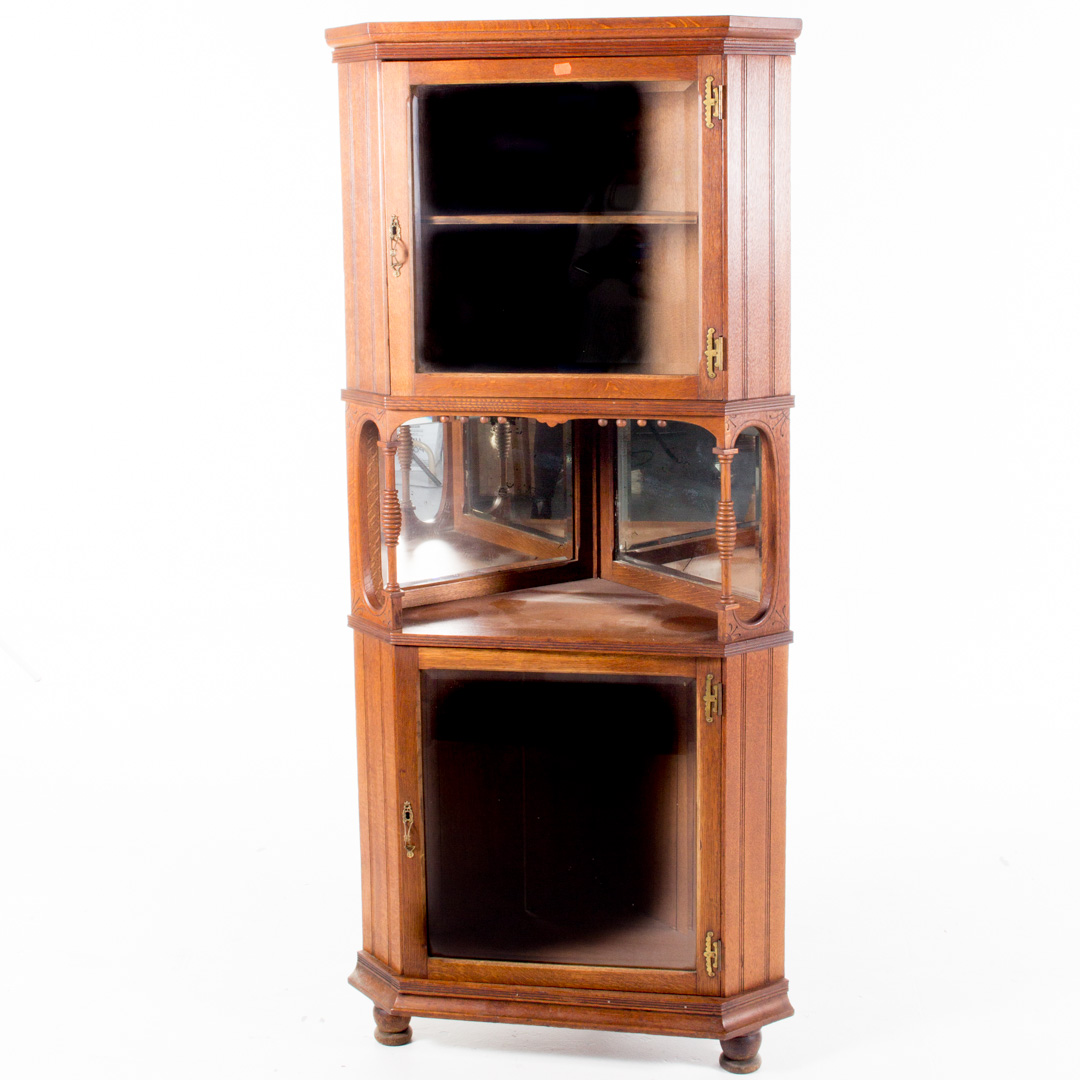 Appraisal: Victorian incised oak diminutive corner cabinet two beveled glass doors