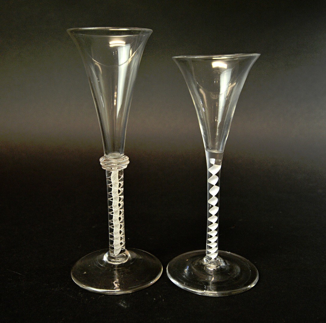 Appraisal: Two English wine glasses circa one with trumpet bowl over