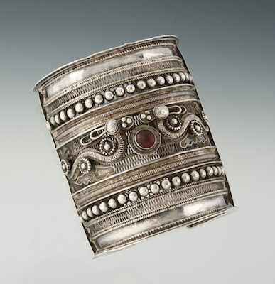 Appraisal: A Northern Thai Cuff Bracelet A tall silver cuff bracelet