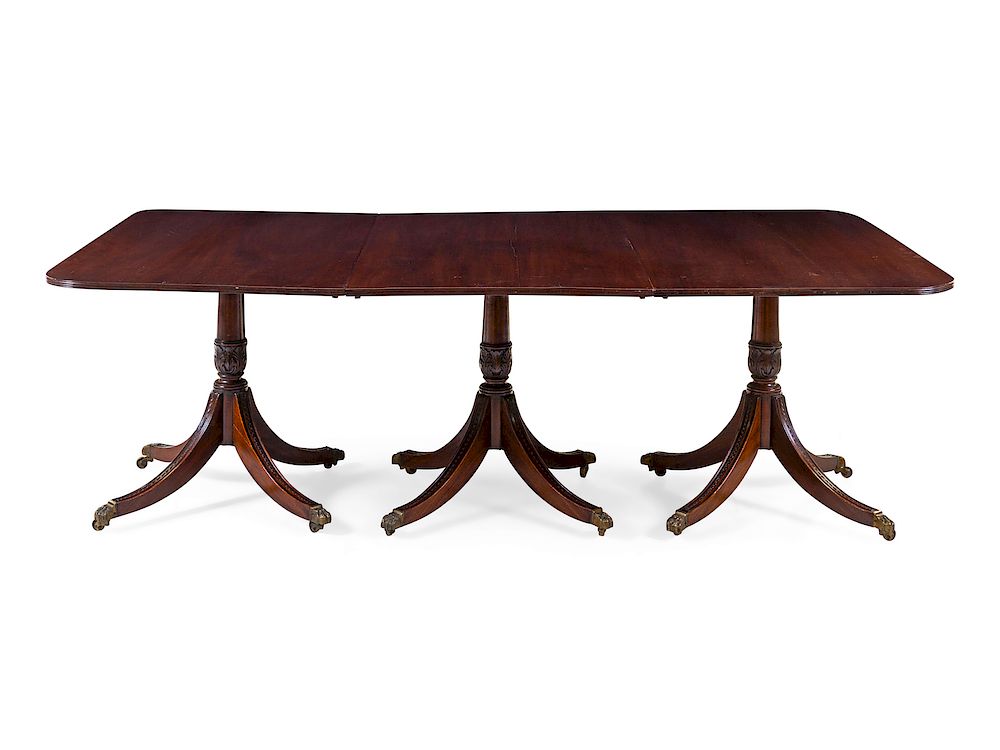 Appraisal: A Regency Style Mahogany Triple-Pedestal Extension Dining Table A Regency