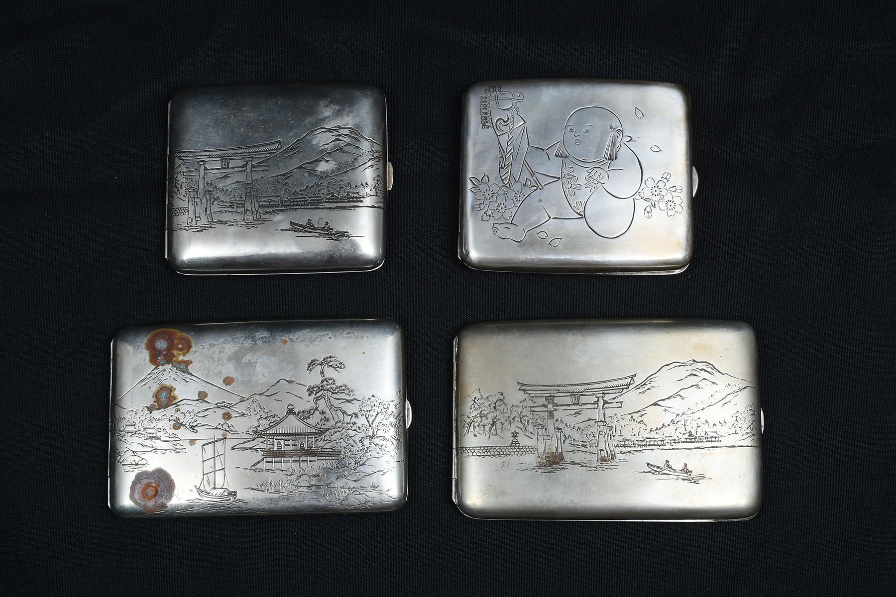 Appraisal: ENGRAVED JAPANESE SILVER CIGARETTE CASES Comprising - Scenic engraved cases