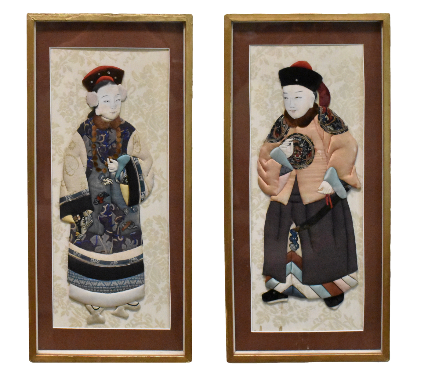 Appraisal: A pair of framed Chinese fabric figures dating from the