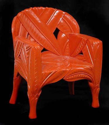 Appraisal: SUZANNE GEISMAR CHIQUITA ARMCHAIR CARVED WOOD AND ORANGE LACQUER SIGNED