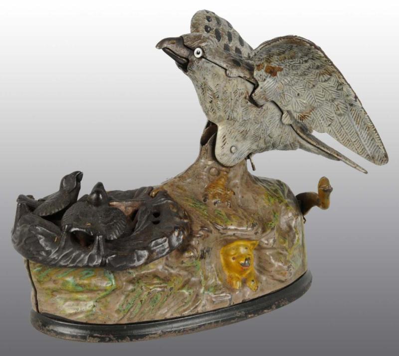 Appraisal: Cast Iron Eagle Eaglets Mechanical Bank Description Manufactured by J