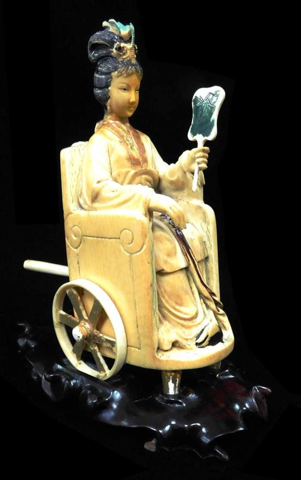 Appraisal: ASIAN Ivory carved maiden in wheeled chair with fan in