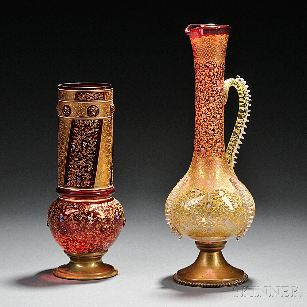 Appraisal: Moser-type Gilded and Enameled Glass Ewer and Vase Bohemia late