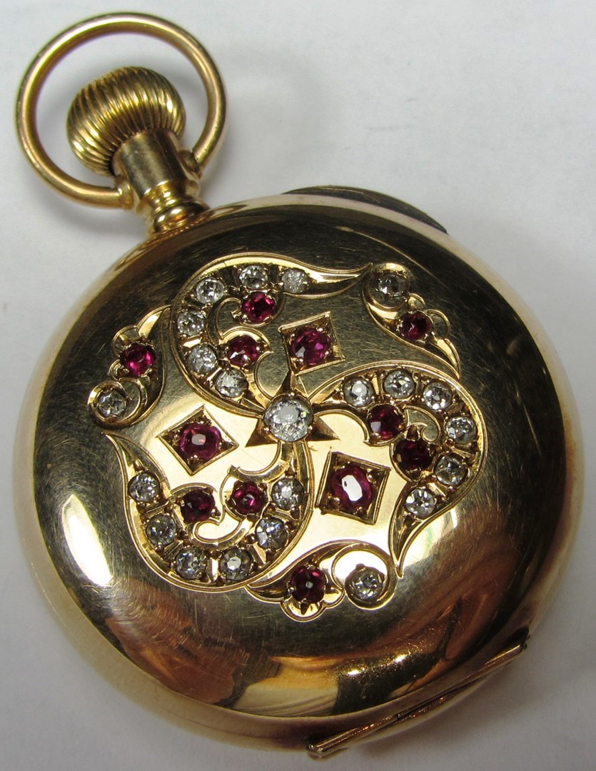 Appraisal: A ladies gold ruby and diamond set keyless wind hunting