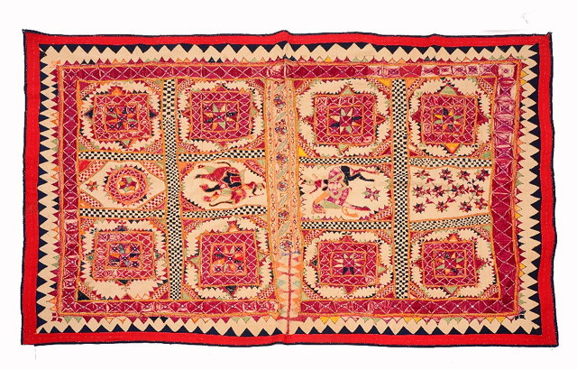 Appraisal: AN INDIAN KATHIAWAR BULLOCK COVER with geometric decoration and central