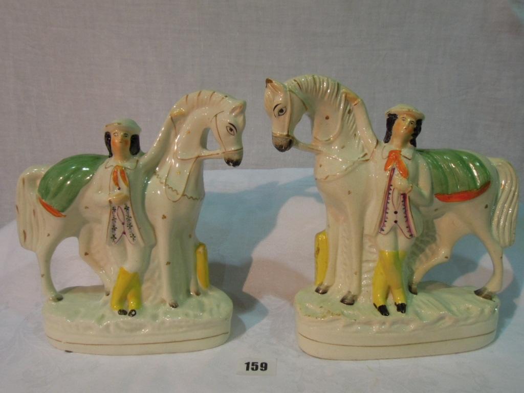 Appraisal: A pair of th century Staffordshire equestrian figures of standing