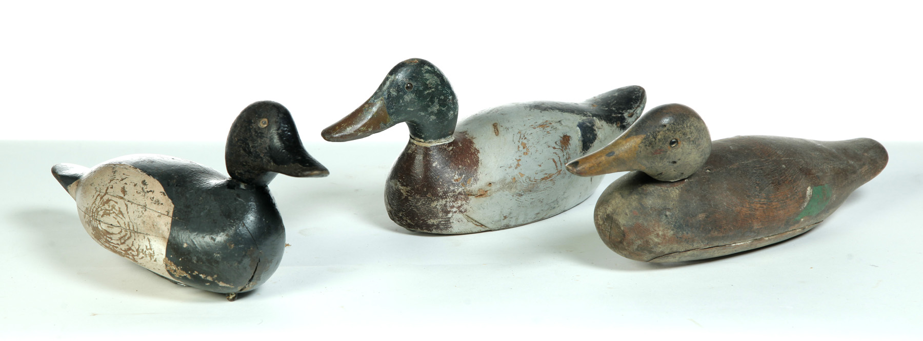 Appraisal: THREE DUCK DECOYS - ONE MARKED EVANS DECOY American st