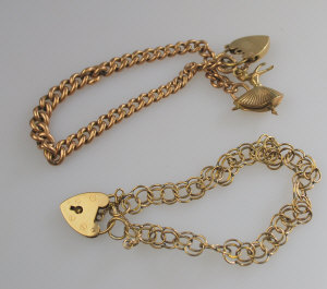 Appraisal: ct curb bracelet with unmarked padlock and gilt metal charm