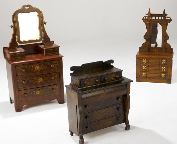 Appraisal: MINIATURE CHESTS OF DRAWERS Three chests two dressers with mirror