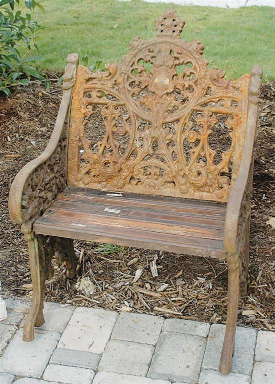 Appraisal: Pair cast-iron and wood garden seats scrolling back and side