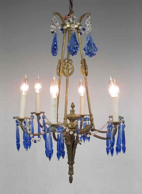 Appraisal: BRONZE AND COBALT CRYSTAL LIGHT CHANDELIER Bronze floral motif light