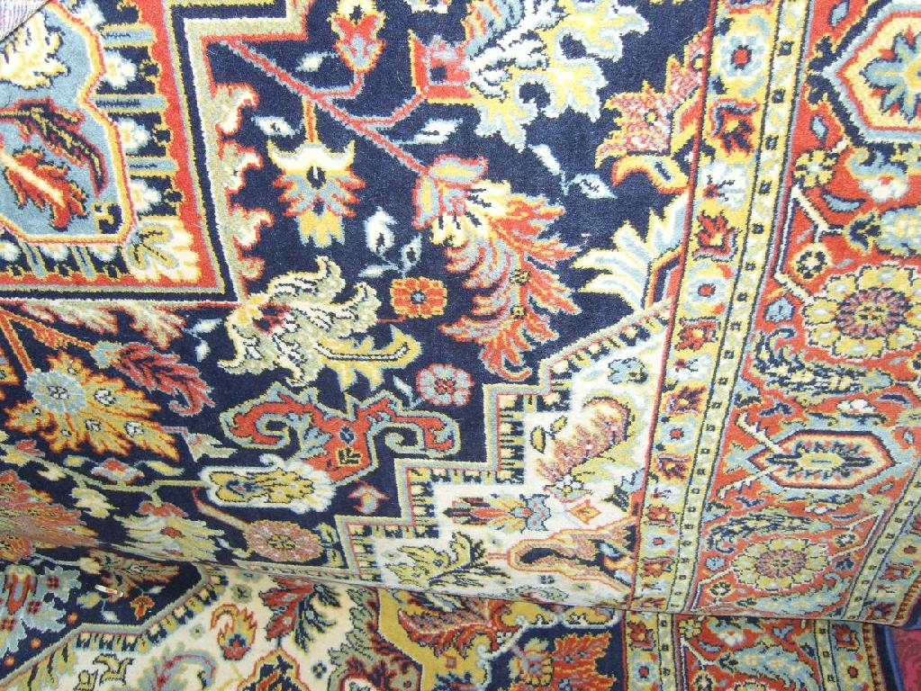 Appraisal: A wool carpet with eastern style polychrome floral decoration within