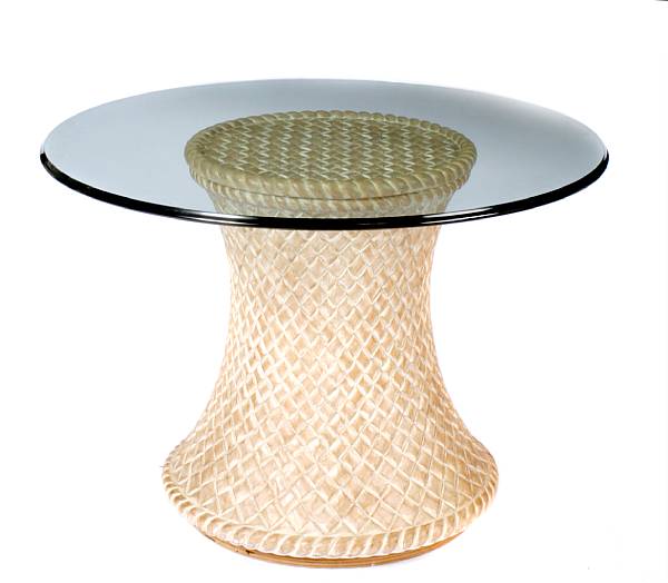 Appraisal: A carved hardwood and glass center table height in diameter