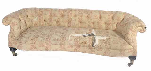 Appraisal: A VICTORIAN BUTTON UPHOLSTERED SOFA with scroll arms and back