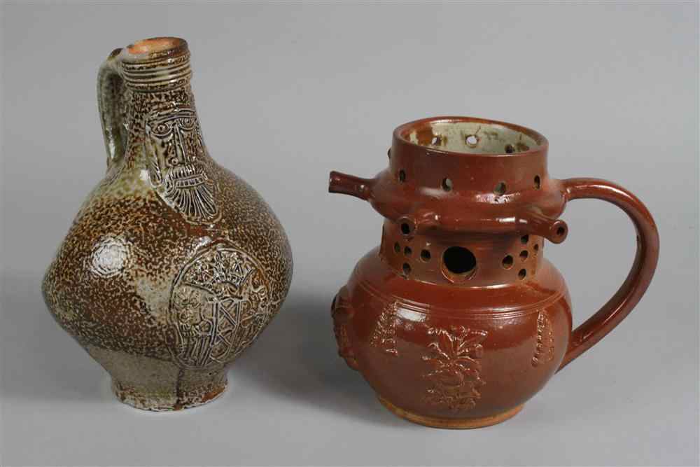 Appraisal: RHENISH SALT GLAZED ''TIGERWARE'' BELLARMINE JUG together with an English