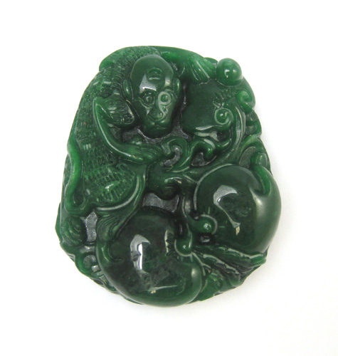 Appraisal: CHINESE ZODIAC AMULET JADE PENDANT The carved green jade monkey