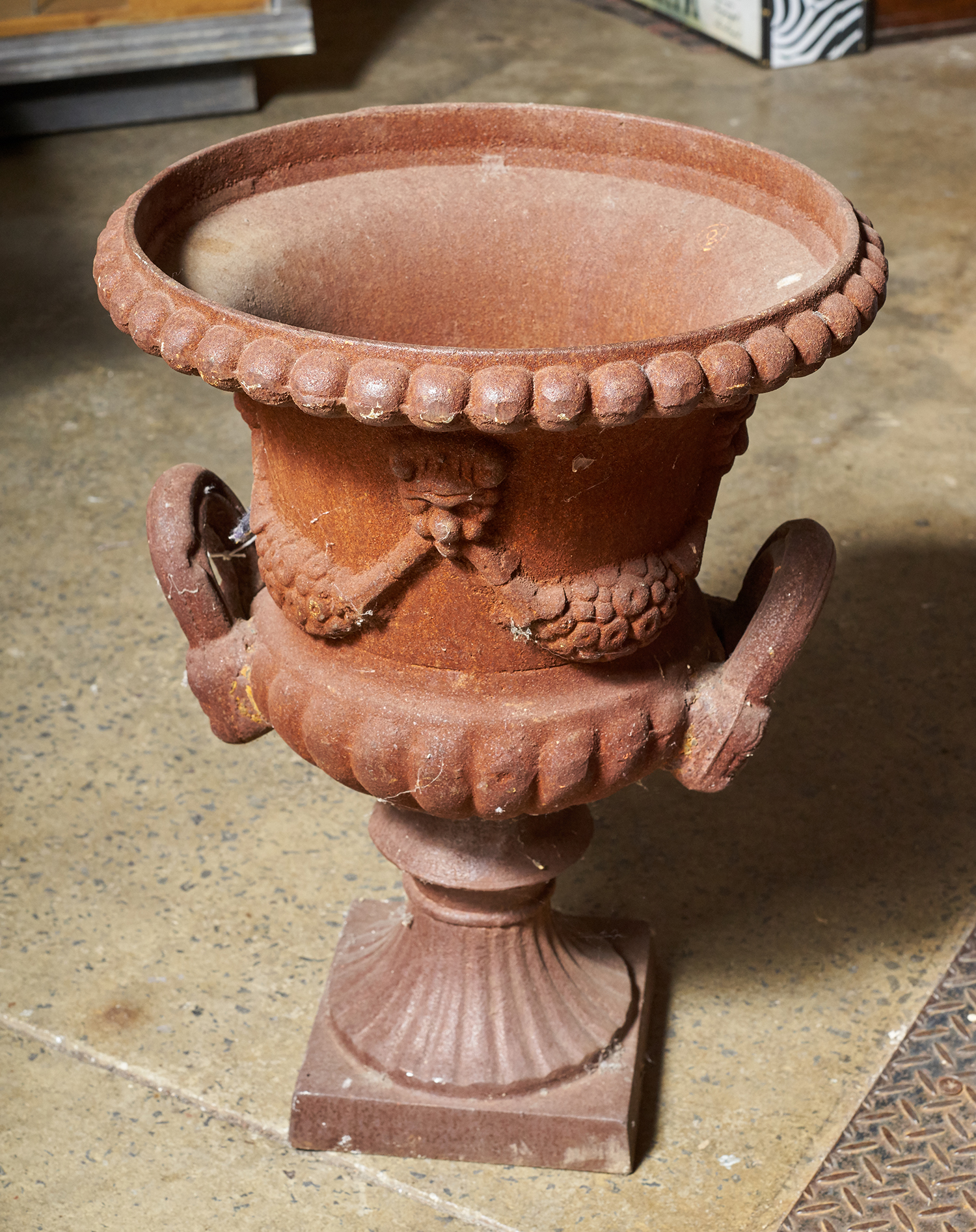 Appraisal: A CAST IRON URN Double handle with floral decoration h