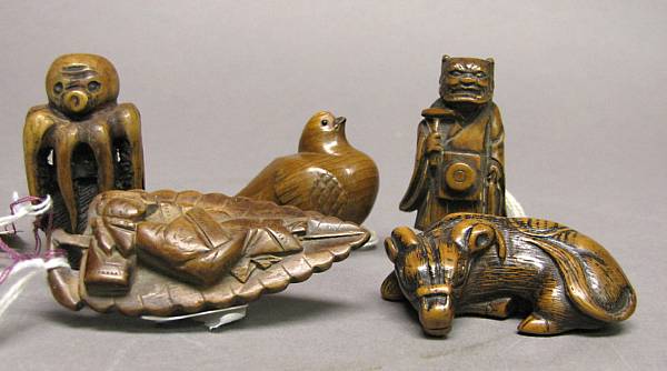 Appraisal: A group of five wood netsuke th th Century comprising