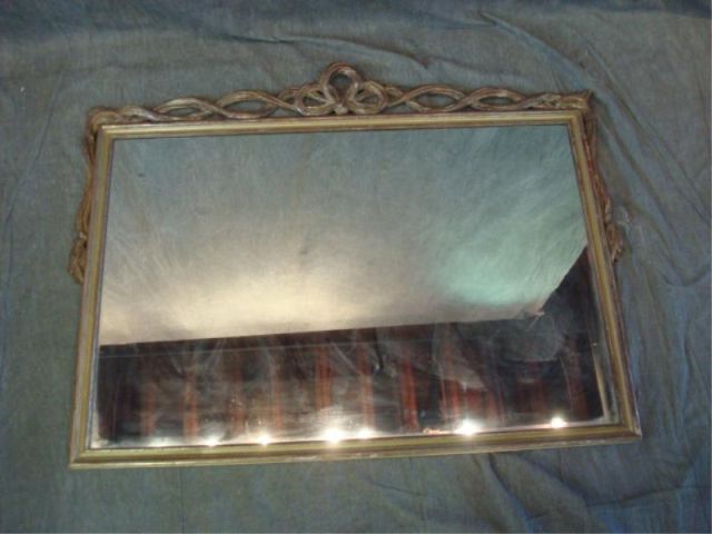 Appraisal: Silver Gilt Wood Framed Mirror with Carved Top Dimensions x