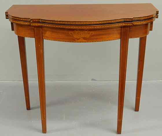 Appraisal: Hepplewhite style inlaid mahogany card table with a shaped top