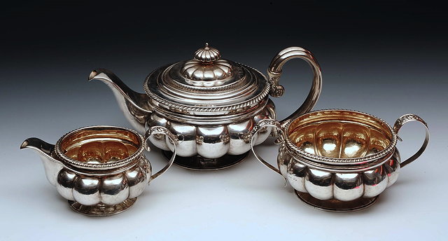 Appraisal: A GEORGE IV SILVER THREE PIECE SILVER TEA SET circular