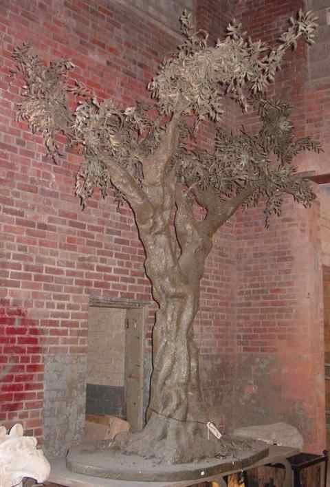 Appraisal: LARGE FAUX PAINTED MOLDED RESIN OLIVE TREE raised on painted