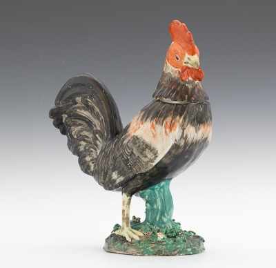 Appraisal: A Staffordshire Rooster Standing two-piece hollow rooster on a circular