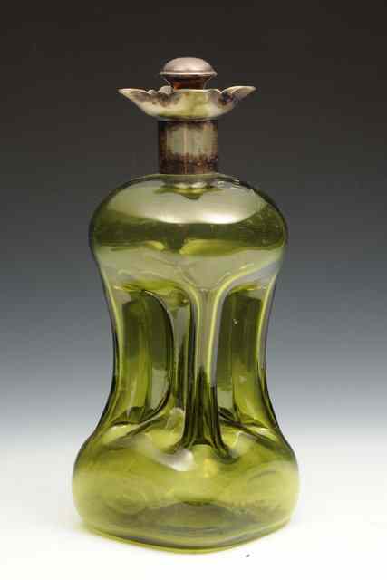 Appraisal: A GREEN GLASS DECANTER with waisted sides and silver plated