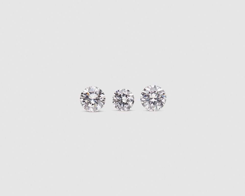 Appraisal: Three Unmounted Diamonds Three Unmounted Diamonds the three round brilliant-cut