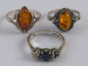 Appraisal: A mixed lot comprising two white metal tests silver amber