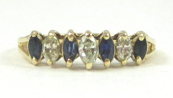 Appraisal: SAPPHIRE DIAMOND AND FOURTEEN KARAT GOLD RING set with four