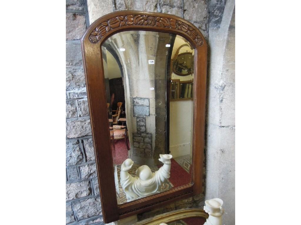 Appraisal: A 's oak framed wall mirror of arched form with