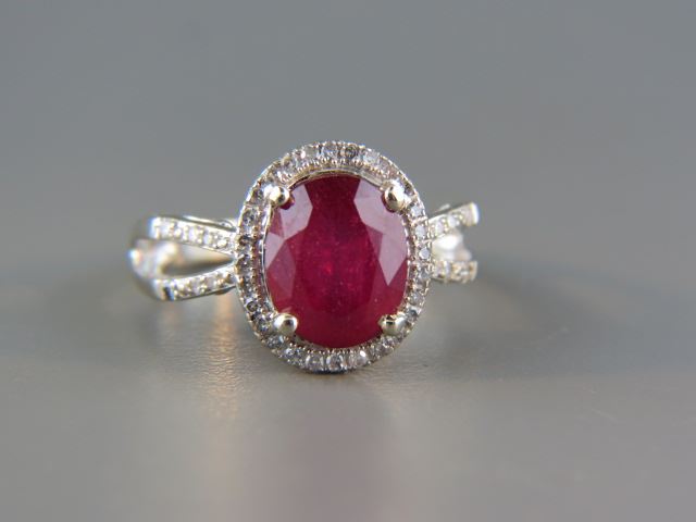 Appraisal: Ruby and Diamond Ring carat rich oval gem surrounded by