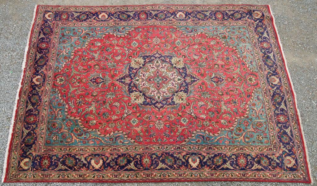 Appraisal: PERSIAN TABRIZ CARPET the central medallion against a red ground