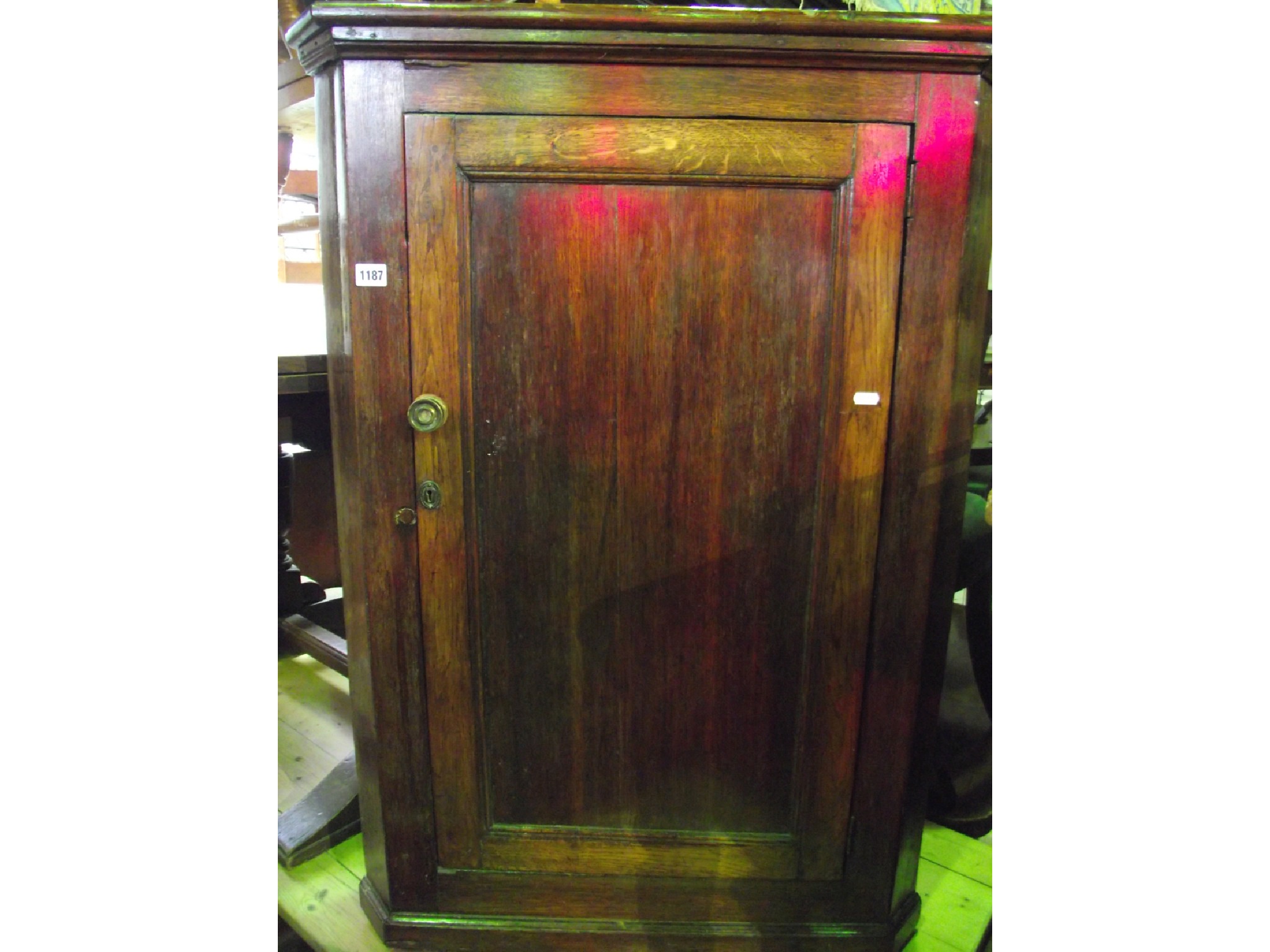 Appraisal: A th century oak hanging corner cupboard enclosed by a