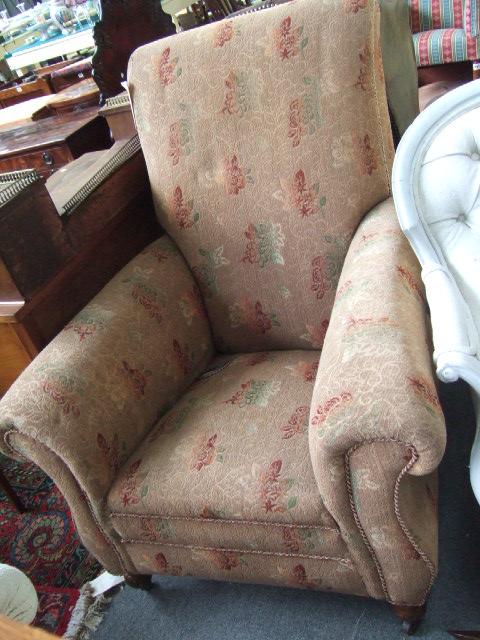 Appraisal: A 's easy armchair with light brown floral upholstery on