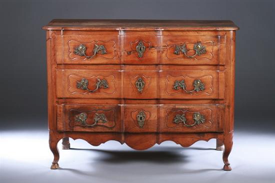 Appraisal: LOUIS XV PROVINCIAL FRUITWOOD SERPENTINE COMMODE th century with scrolling-foliate